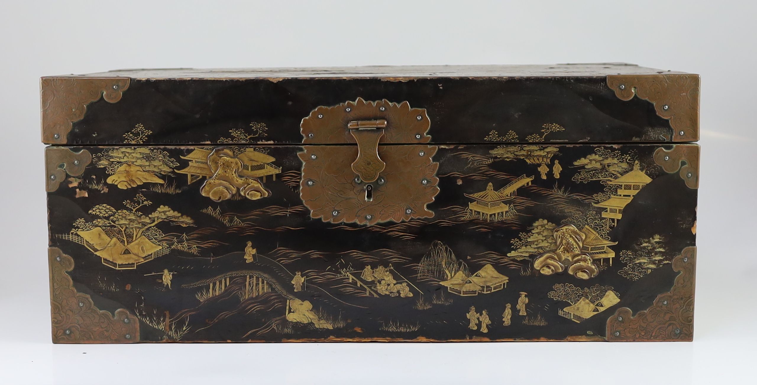 A Japanese lacquer fitted travelling trunk, 19th century, 55cm wide, H 23cm. D 32cm. Some losses to lacquer and wear to mounts